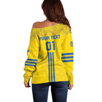 Women's yellow off-shoulder football sweater, blue striped sides, 'YOUR TEXT' back print