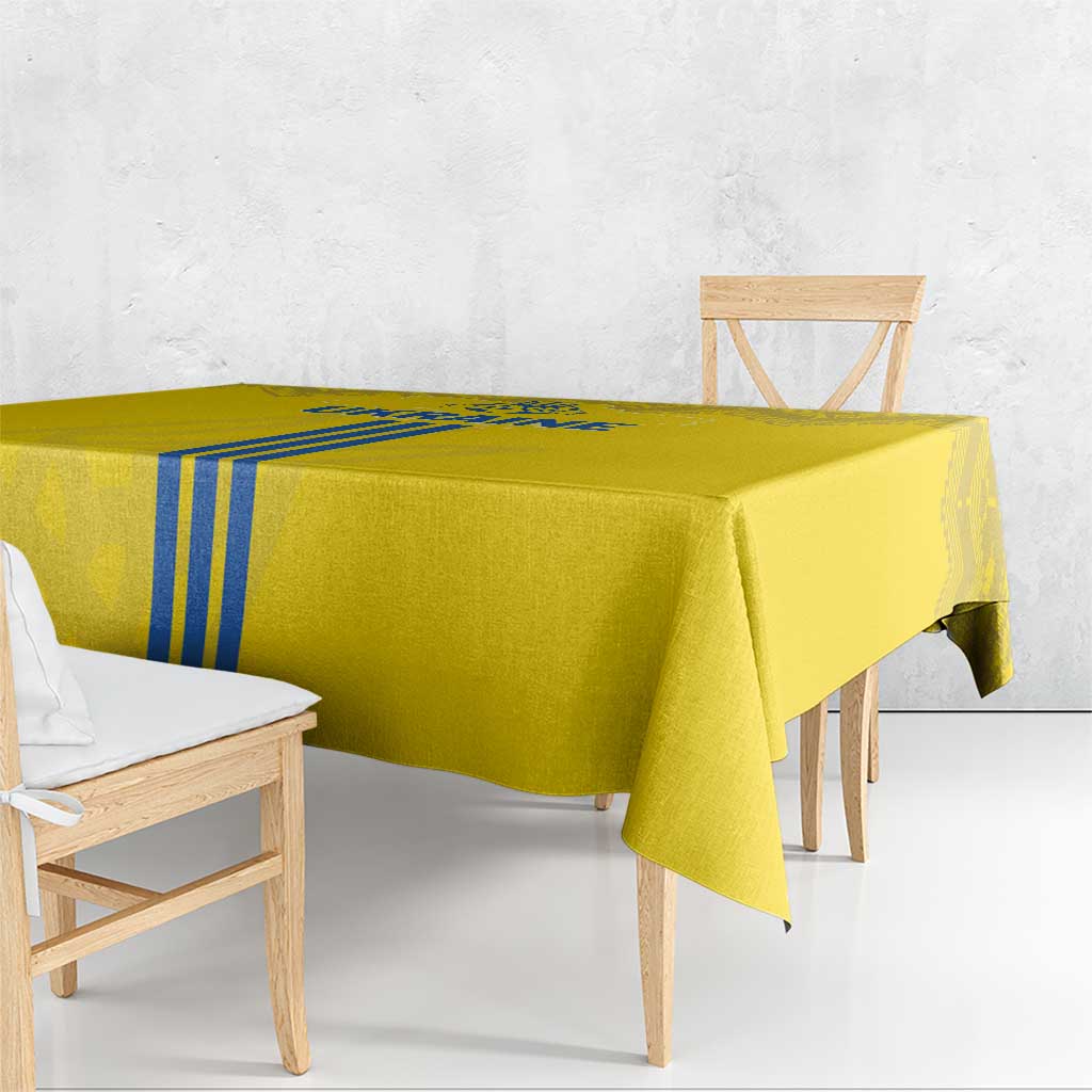 Yellow tablecloth with hanging corners and vertical blue stripe accents