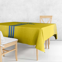 Yellow tablecloth with hanging corners and vertical blue stripe accents