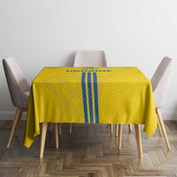 Yellow rectangular tablecloth with blue striped emblem at center