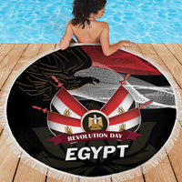 Round beach blanket featuring black, red, and white Egypt emblem with tassel fringe