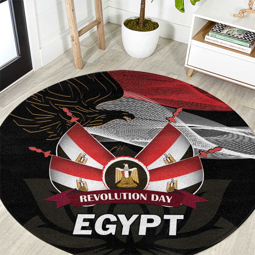 Round black carpet with red and white emblem, eagle, and 'REVOLUTION DAY EGYPT' text