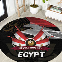 Round black carpet with red and white emblem, eagle, and 'REVOLUTION DAY EGYPT' text
