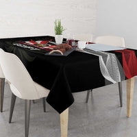 Black tablecloth with red and white eagle crest and lotus flower motif
