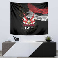 Black tapestry with eagle emblem, red and white banner, and “Revolution Day Egypt”