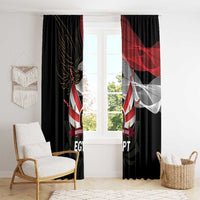 Black window curtain panels with Egyptian flag and eagle print on a window