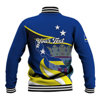 Back view blue baseball jacket with striped ribbed hem and full-color crest graphic