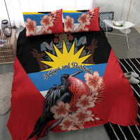 Red duvet cover with black bird, pink hibiscus blooms, blue-yellow sunburst crest, two pillows