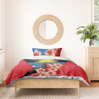 Red duvet and pillowcases with black bird, pink hibiscus, blue-yellow emblem strip