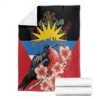 Antigua and Barbuda blanket folded, black-red-blue with frigatebird and pink hibiscus flowers
