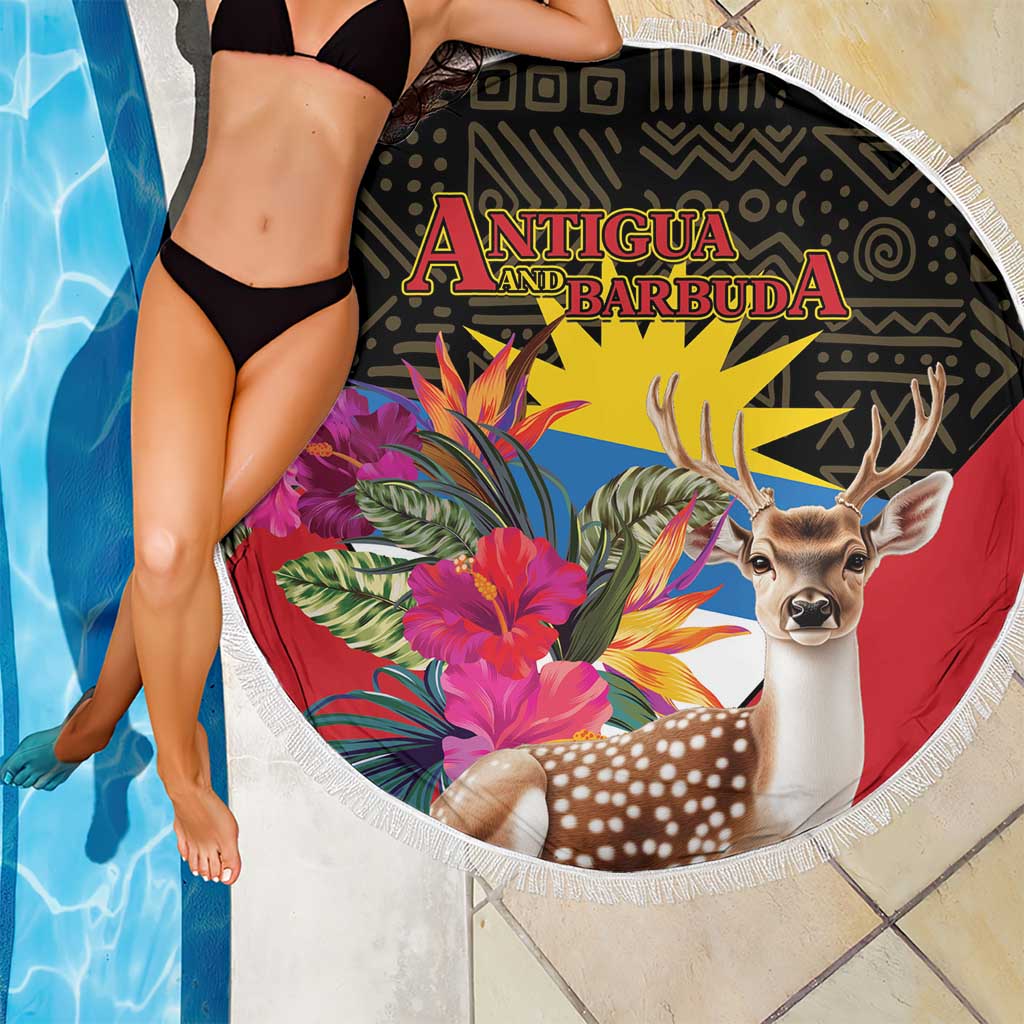 Fringed round beach blanket being held, with deer and tropical flowers, Antigua and Barbuda print
