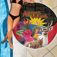 Fringed round beach blanket being held, with deer and tropical flowers, Antigua and Barbuda print