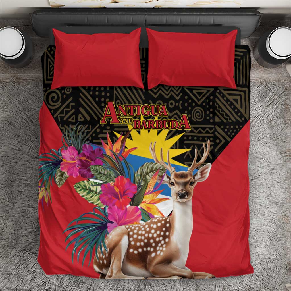 Red duvet and two pillows with deer and tropical floral bouquet on dark geometric panel