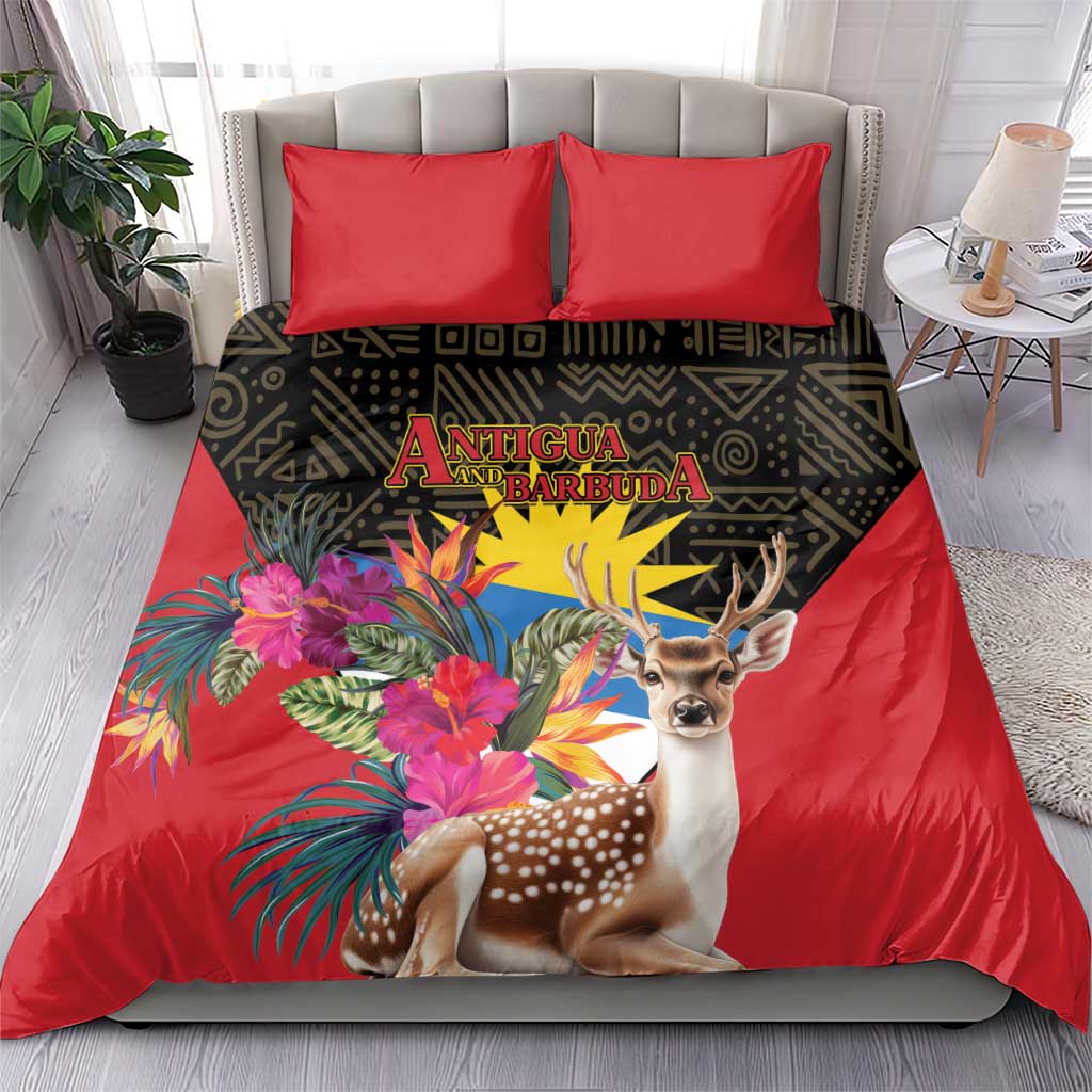 Red duvet and two pillows with deer and bright tropical flowers on dark patterned panel
