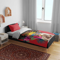 Red duvet and pillowcases with deer and tropical bouquet print on dark geometric fabric