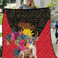 Red and black quilt blanket with deer, tropical flowers, and Antigua and Barbuda text