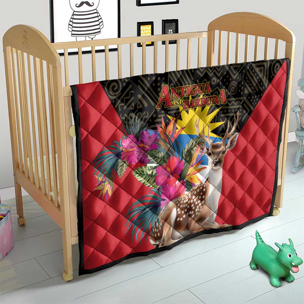 Red quilt blanket with black border, deer and tropical flowers on a baby bed
