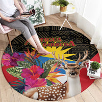 Round area rug with deer head, colorful tropical bouquet, and red center circle