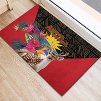 Red rubber doormat on wood floor, black patterned band with deer and flower artwork