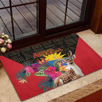 Red rubber doormat by doorway, black geometric design with deer and tropical flowers