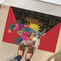 Red rubber doormat with black border, deer portrait, and tropical flowers; centered title