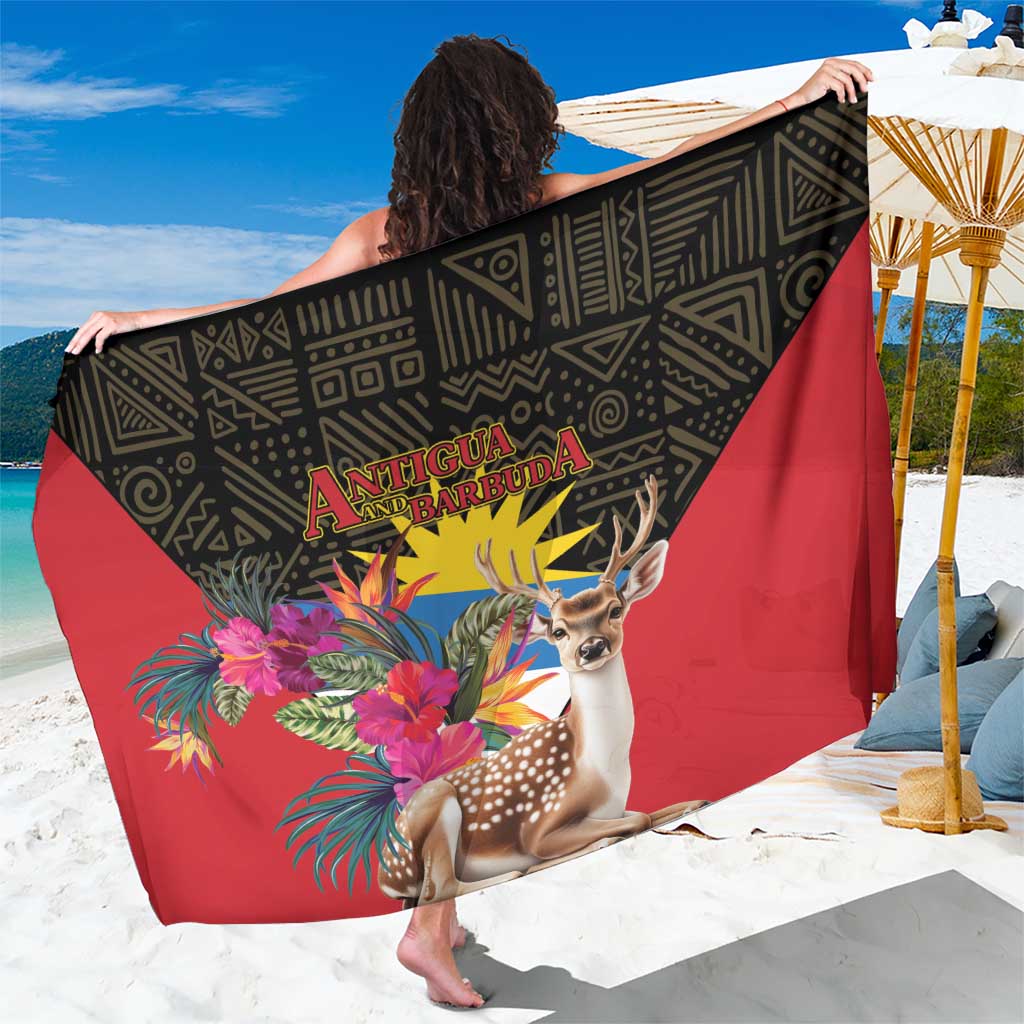 Sarong with dark green and red tropical deer print and geometric band at center