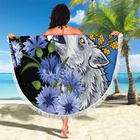 Round 150 cm beach blanket held open, blue fringed edge with wolf and floral print