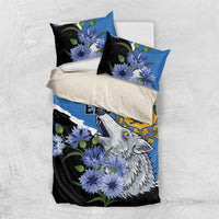 Blue and black bedding set with wolf and blue flowers, styled with white bedding