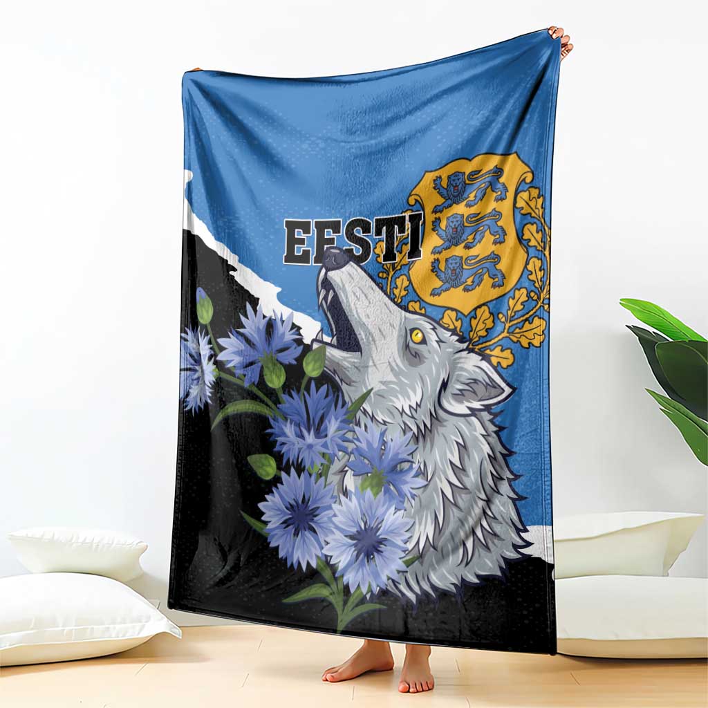 Folding display of blue and black wolf blanket with Esti text and flower accents