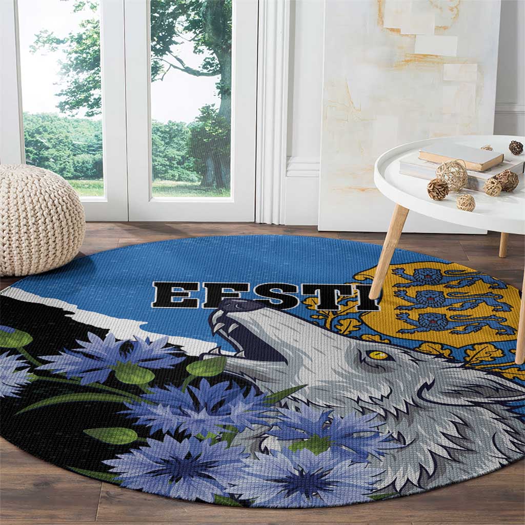 Round area rug with EFSTI text, grey wolf profile, blue flowers and green leaves