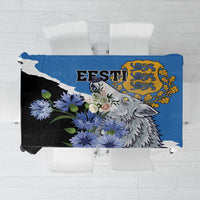 Blue tablecloth with wolf graphic, wildflowers, and decorative crest design