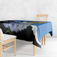 Blue rectangular tablecloth with wolf and purple wildflower print, corner drop