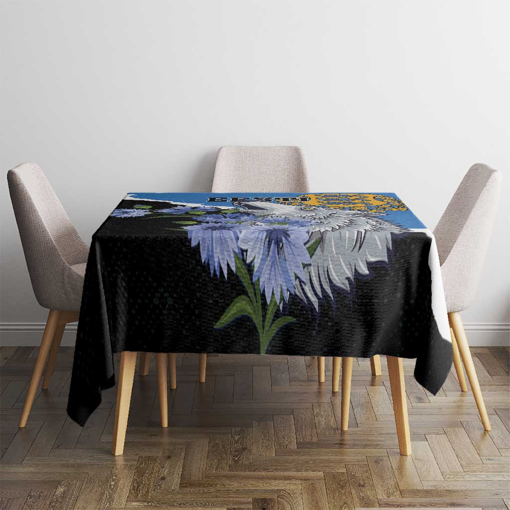 Blue tablecloth with wolf face and floral artwork, shown on a dining table