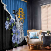Blue window curtain with wolf portrait and yellow crest, black/white diagonal stripe, flowers