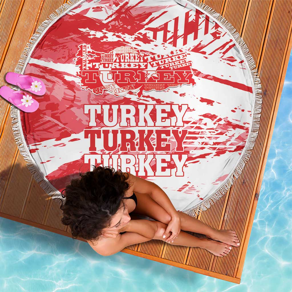 Round beach blanket with red-and-white Turkey typography, tassel fringe border