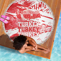 Round beach blanket with red-and-white Turkey typography, tassel fringe border