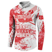 Red and white quarter-zip sweatshirt with Turkey text and small flag patch on sleeve