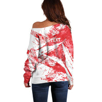Red/white off-shoulder sweater with back grunge print and stripes, long sleeves