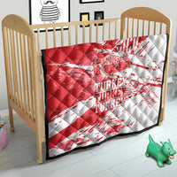 Red and white Turkey map quilt over a wooden crib, quilted with “TURKEY” text