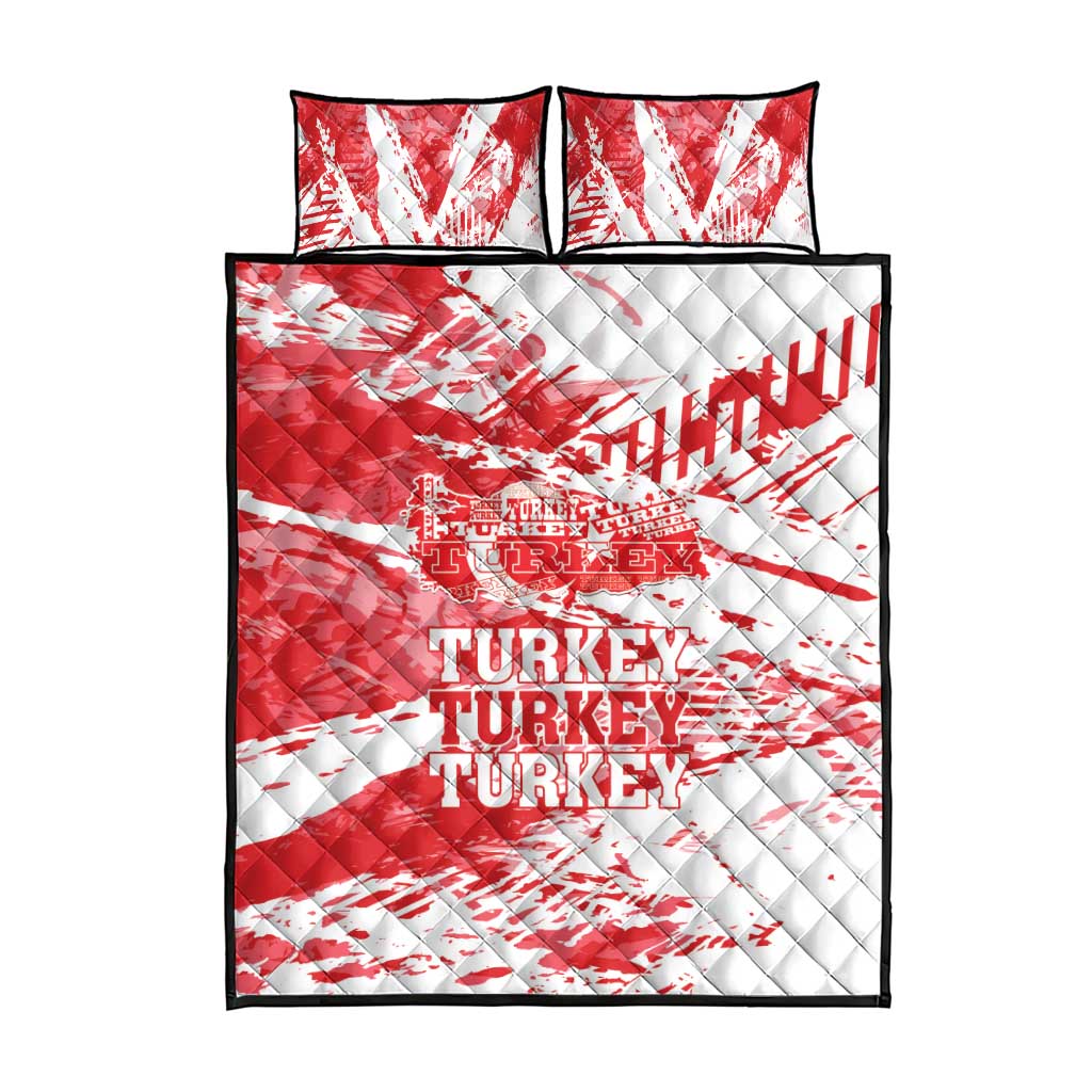 Red and white quilt bed set with quilted diamond pattern and Turkey text, plus two pillows.