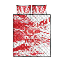 Red and white quilt bed set with quilted diamond pattern and Turkey text, plus two pillows.