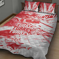 Red and white quilt bed set with repeating Turkey text and quilted surface.