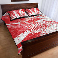 Red and white quilt bed set with Turkey text and diagonal red stripe accents, with two pillows.
