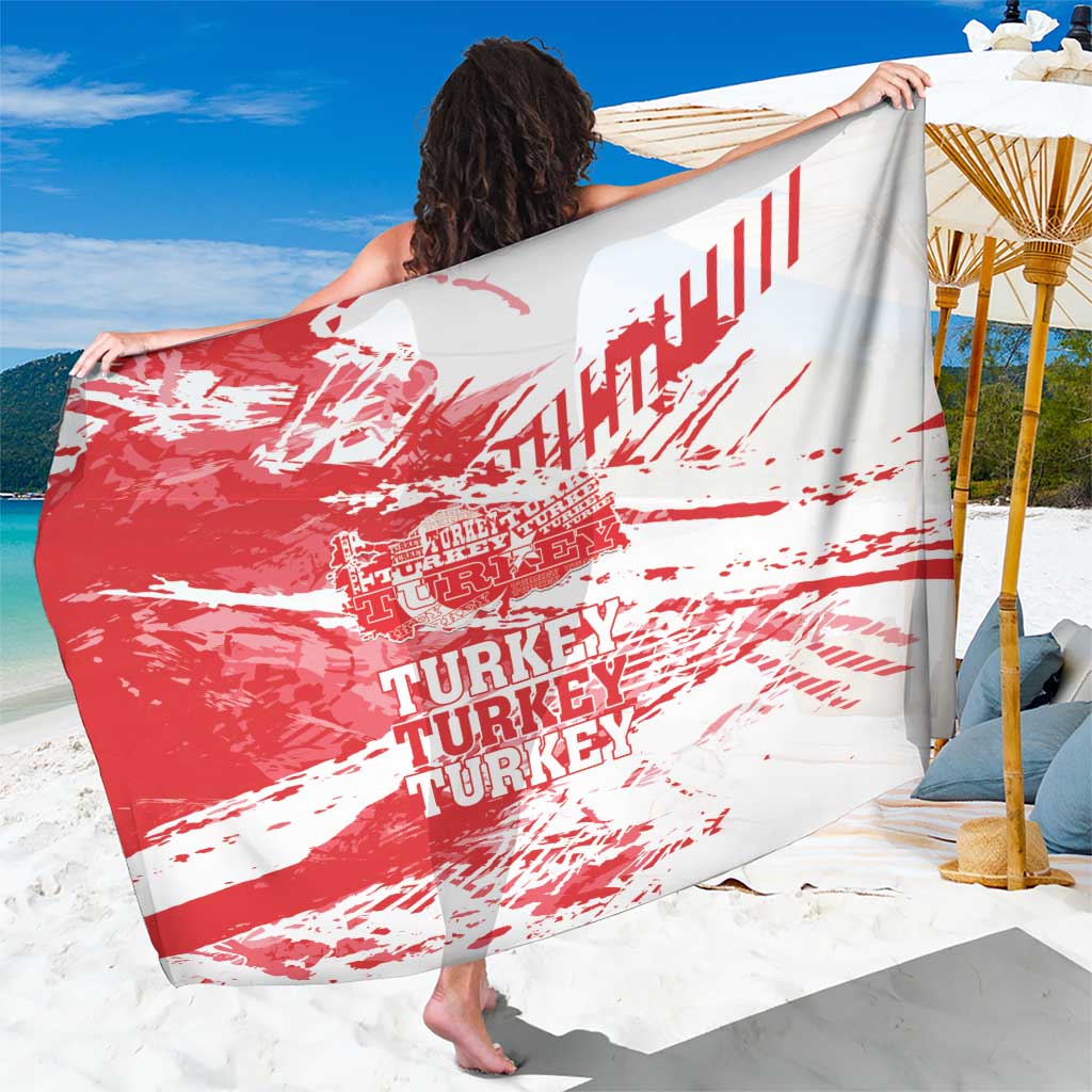 Red and white grunge Turkey map sarong with distressed text, draped over shoulders