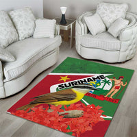Rectangular area rug featuring Suriname lettering, green border, red flowers, and bird