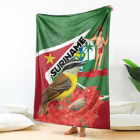 Suriname-themed blanket displayed upright, green-and-red flag print with bird and woman