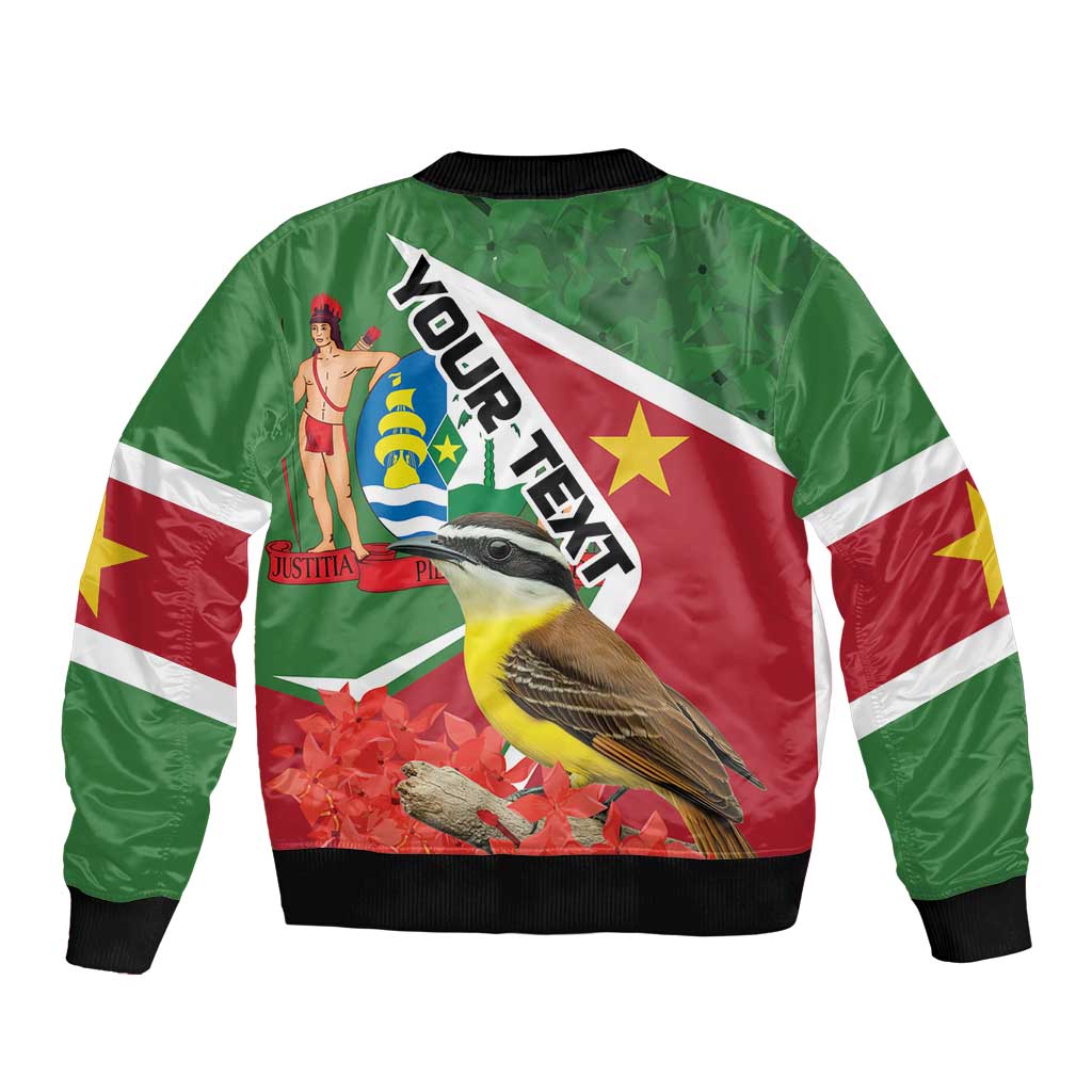 Green bomber jacket back with diagonal text, bird and floral graphic, black ribbed hem
