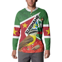 Green long-sleeve button sweatshirt worn by model, front graphic bird and floral design