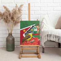 Suriname canvas wall art on wooden easel, featuring tropical bird over red floral pattern