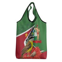 Green and red Suriname print tote bag with bird and floral accents, top carry handles